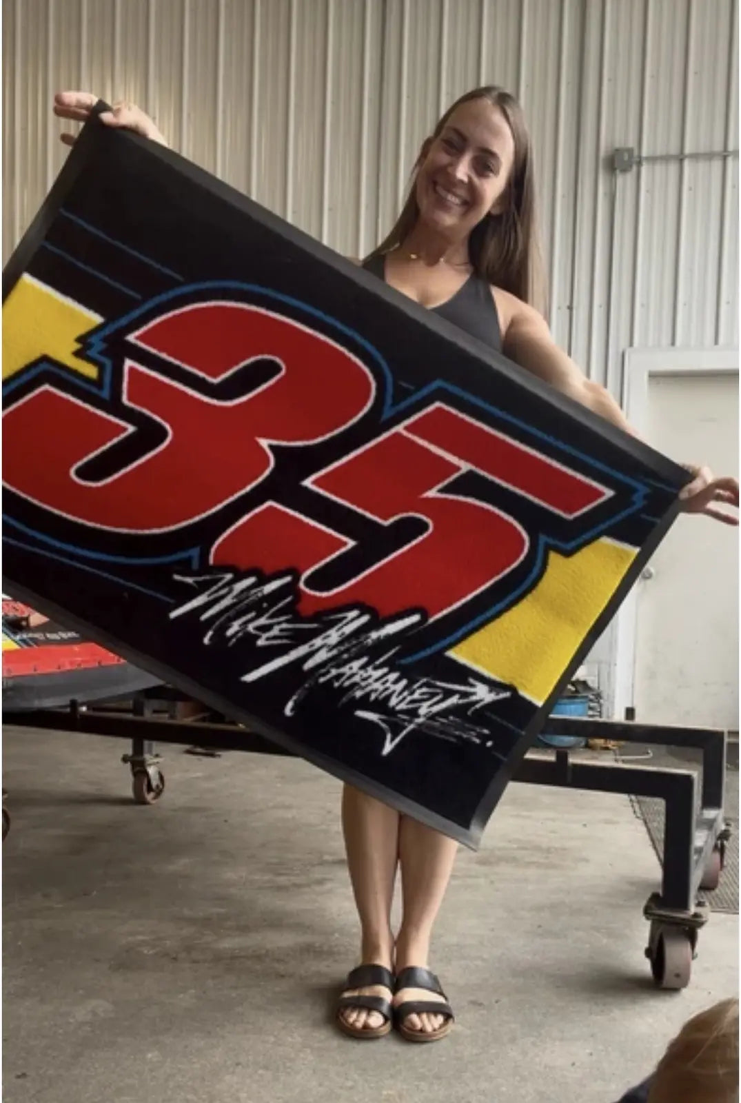 Round black custom hockey logo mat in use