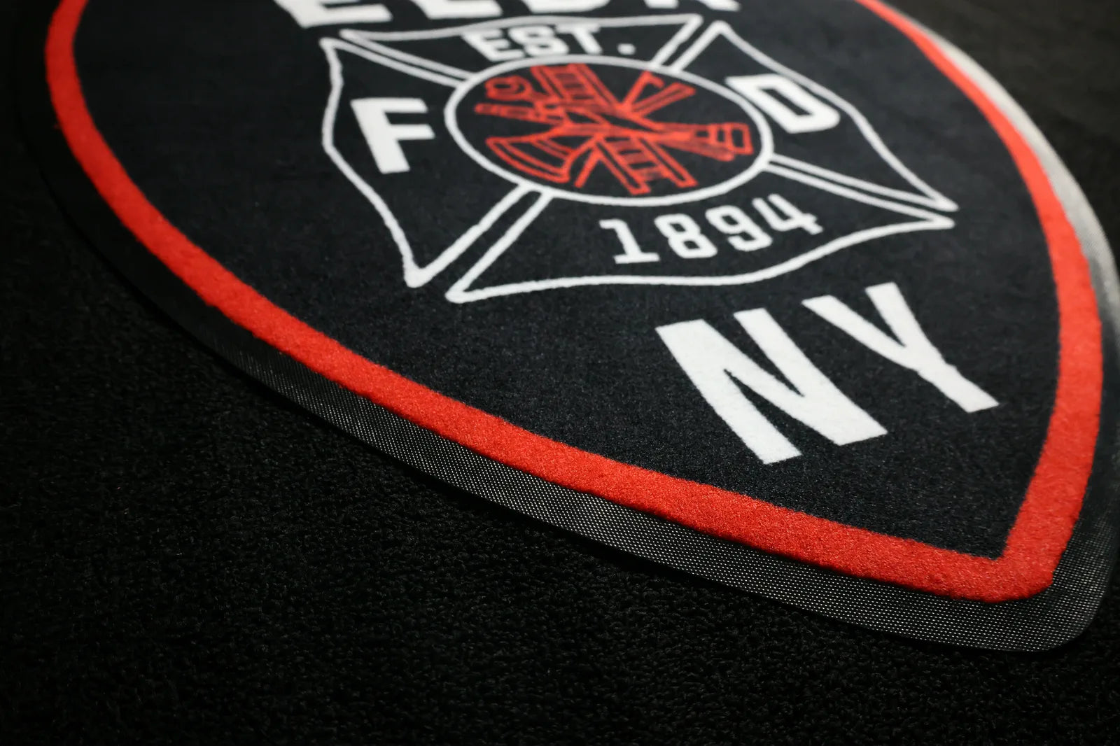 ShapeShifter Logo Mat carpeted surface