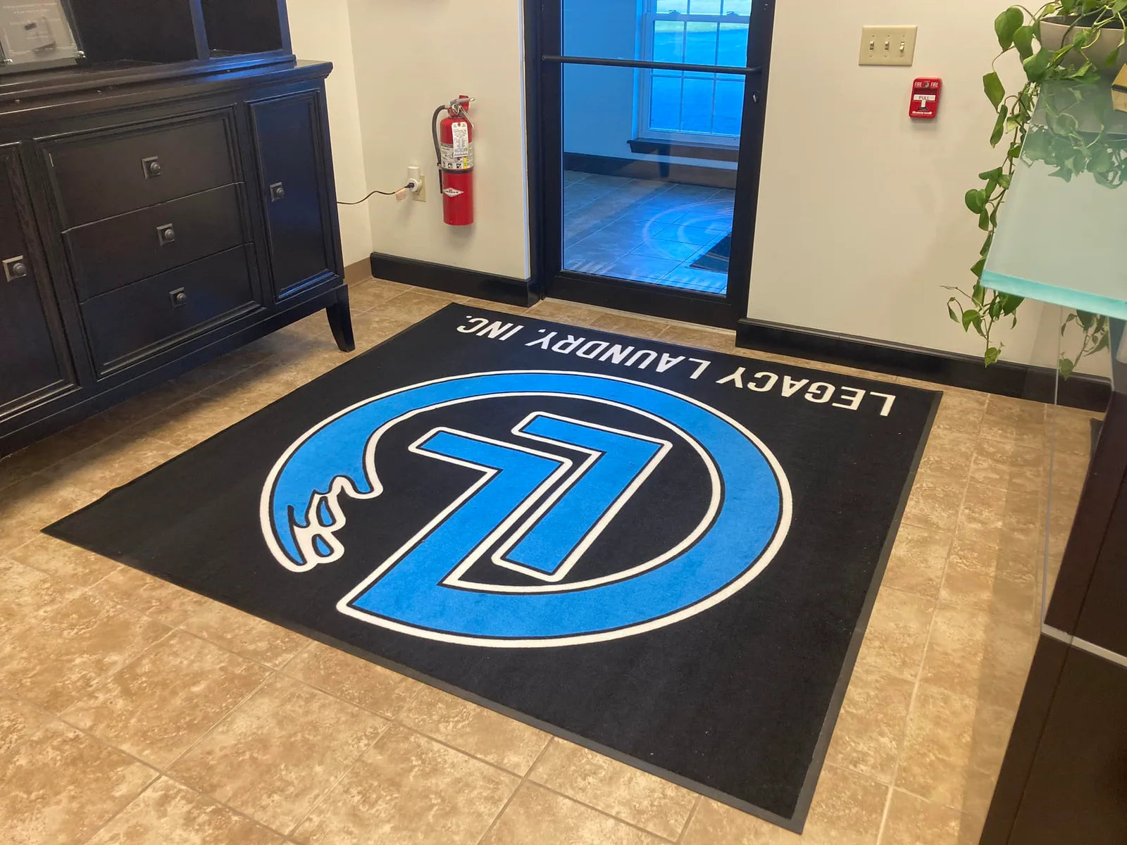 Blue custom Original MysticMat installed in a lobby